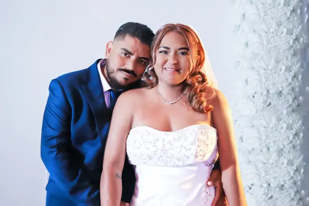 Wedding couple portrait photographed with soft natural tones.